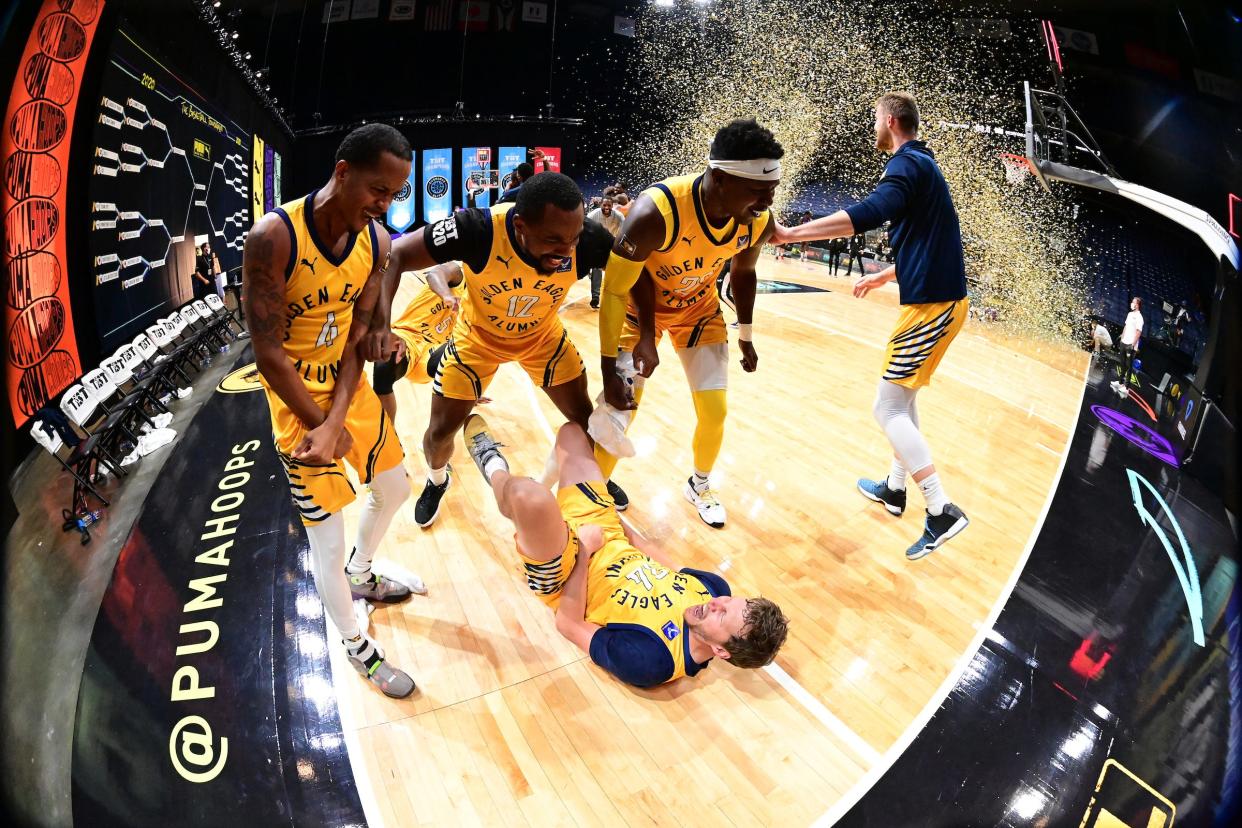 The Golden Eagles surround Travis Diener after he hit a three-pointer to win the The Basketball Tournament in 2020.