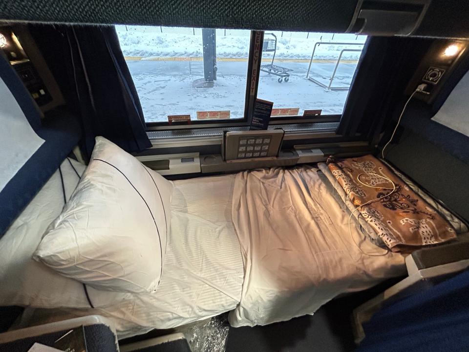 The made bed in an Amtrak roomette.