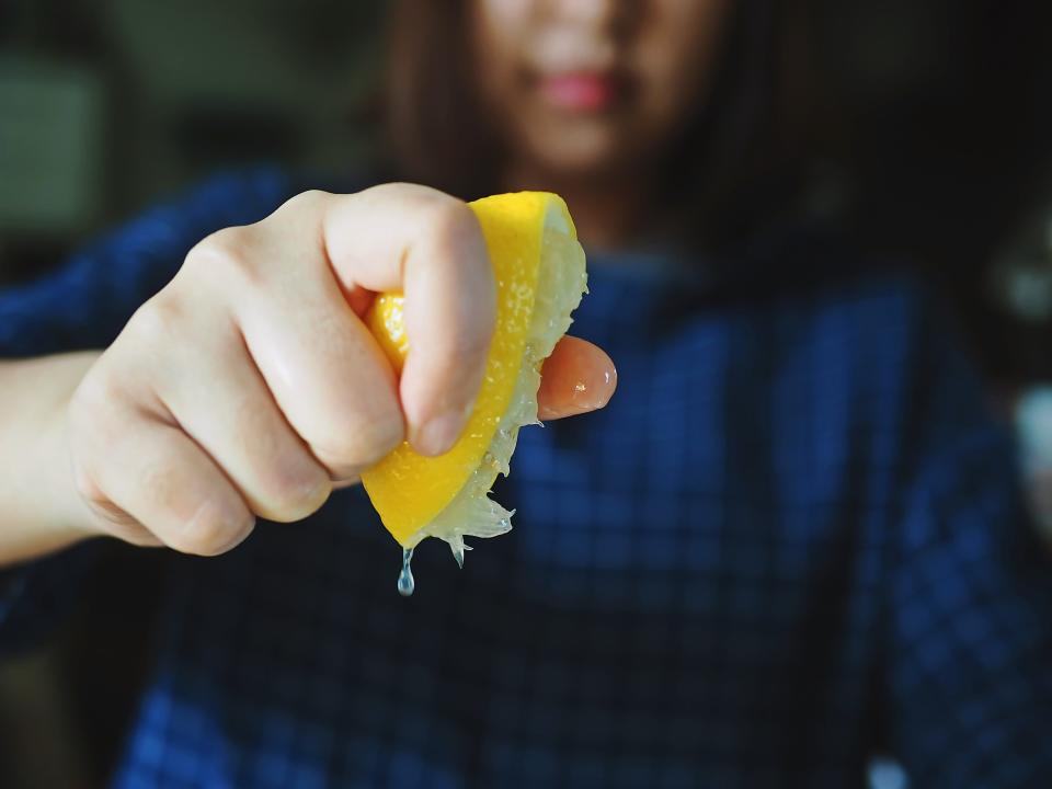 lemon woman squeezing lemon