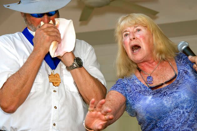 In this photo provided by the Florida Keys News Bureau, Michael Wachter, left, and Georgann Wachter perform during the Conch Shell Blowing Contest, Saturday, March 4, 2023, in Key West, Fla. The couple won the contest's group division by parodying Elvis Presley's 