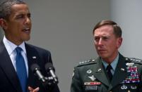 US Gen. David Petraeus (R) listens to President Barack Obama announce him as the successor of US commander in Afghanistan General Stanley McChrystal in Washington, DC in 2010. As Obama moved to draw down US forces from Afghanistan, Petraeus moved to the CIA last year at a time when the agency was involved in a drone war against insurgents in Pakistan and Yemen