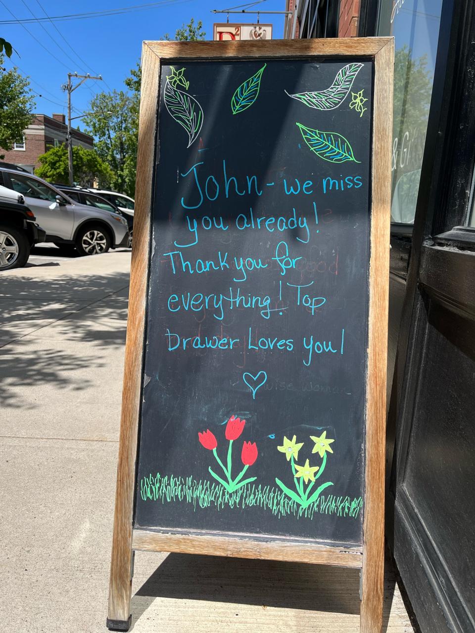 Local businesses on Water Street put up signs for John Hartz in honor of his last day on Friday, May 26.