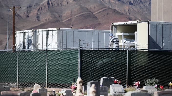 Low-level inmates in Texas prepare to load bodies wrapped in plastic into a refrigerated temporary morgue trailer in a parking lot of the El Paso County Medical Examiner’s office. On Saturday, the Lone Star State’s department of health reported more than 20,000 new cases of COVID-19. (Photo by Mario Tama/Getty Images)