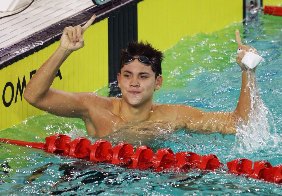 PALEMBANG, SUMATRA, INDONESIA - NOVEMBER 12:  Joseph Schooling of Singapore celebrates winning the Mens 50m Butterfly Final on day two of the 2011 Southeast Asian Games at Jakabaring Sports Complex on November 12, 2011 in Palembang, Sumatra, Indonesia.  (Photo by Matt King/Getty Images)