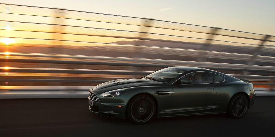 <p>One of the ultimate variants on the DB9–before the launch of the Vanquish–was the <a rel="nofollow noopener" href="https://www.roadandtrack.com/new-cars/reviews/a14358/2009-aston-martin-dbs/" target="_blank" data-ylk="slk:DBS;elm:context_link;itc:0;sec:content-canvas" class="link "><u>DBS</u></a>, which brought back the name of the DB6's successor. More aggressive styling, featuring extensive carbon fiber bodywork, paired well with a 510-bhp version of Aston's now-familiar V12. </p><p>The DBS appeared in Daniel Craig's first James Bond film, <em>Casino Royale</em>. </p>
