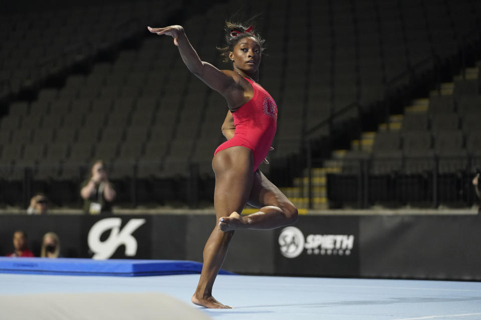 Simone Biles, a seven-time Olympic medalist and the 2016 Olympic champion, practices on the floor exercise at the U.S. Classic gymnastics competition Friday, Aug. 4, 2023, in Hoffman Estates, Ill. (AP Photo/Erin Hooley)