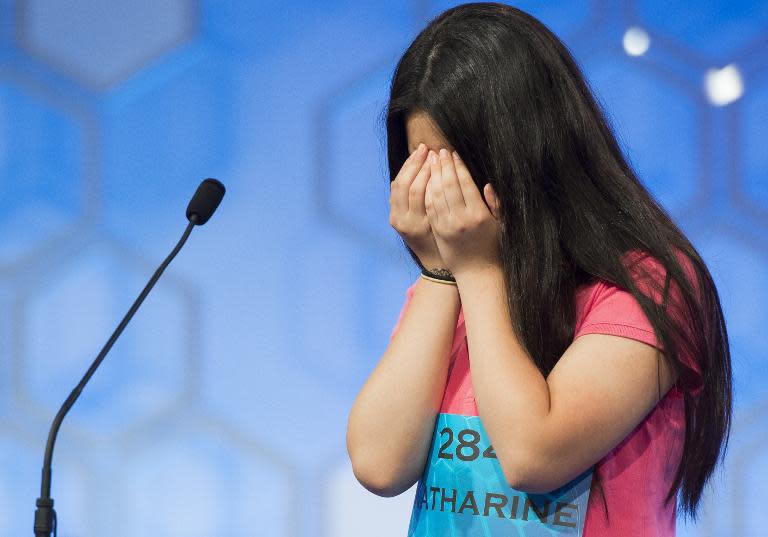 Katharine Wang of Morristown, New Jersey, reacts after hearing her word during the semifinal round of the 88th Annual Scripps National Spelling Bee at National Harbor in Oxon Hill, Maryland, May 28, 2015