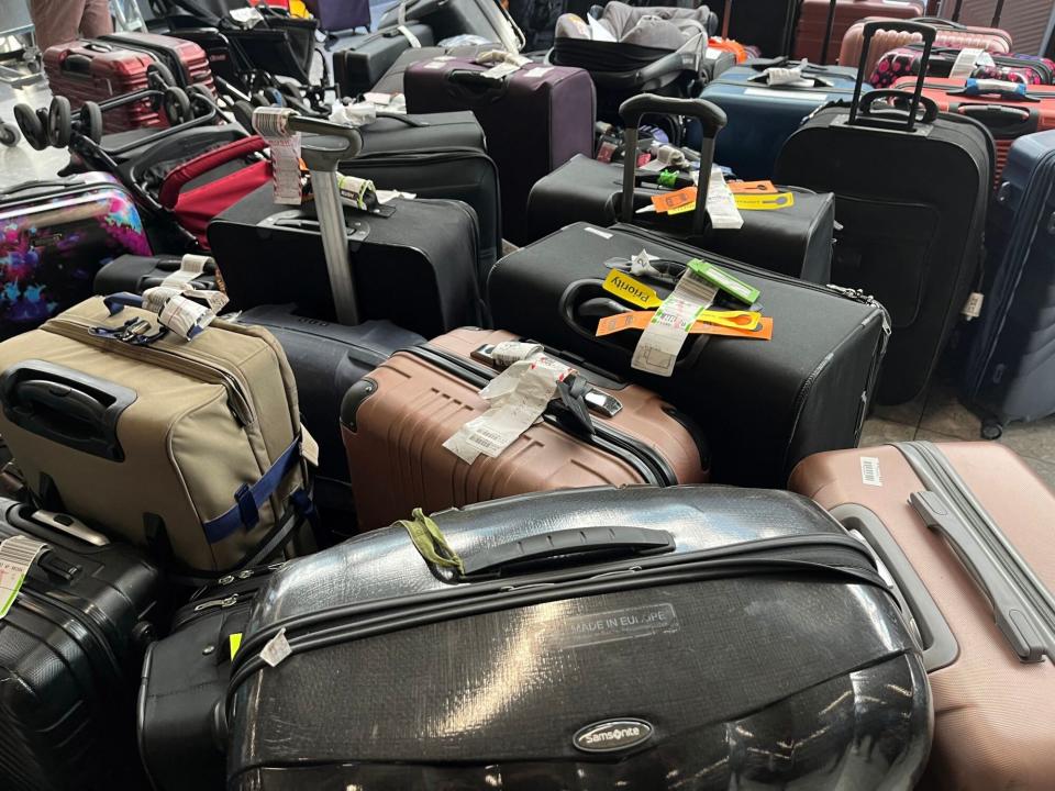 Suitcases are seen uncollected at Heathrow's Terminal Three bagage reclaim, west of London on July 8, 2022. - British Airways on Wednesday axed another 10,300 short-haul flights up to the end of October, with the aviation sector battling staff shortages and booming demand as the pandemic recedes. (Photo by Paul ELLIS / AFP) (Photo by PAUL ELLIS/AFP via Getty Images)