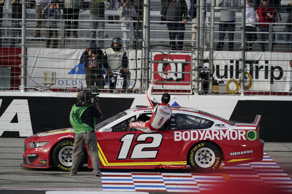 Ryan Blaney celebrates his win after a NASCAR Cup Series auto race at Atlanta Motor Speedway on Sunday, March 21, 2021, in Hampton, Ga. (AP Photo/Brynn Anderson)