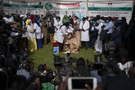 A health worker administers a dose of China's Sinopharm vaccine to a man during the start of the vaccination campaign against the COVID-19 at the Health Ministry in Dakar, Senegal, Tuesday, Feb. 23, 2021. The country is also expecting nearly 1.3 million vaccine doses through the COVAX initiative. (AP Photo/Leo Correa)