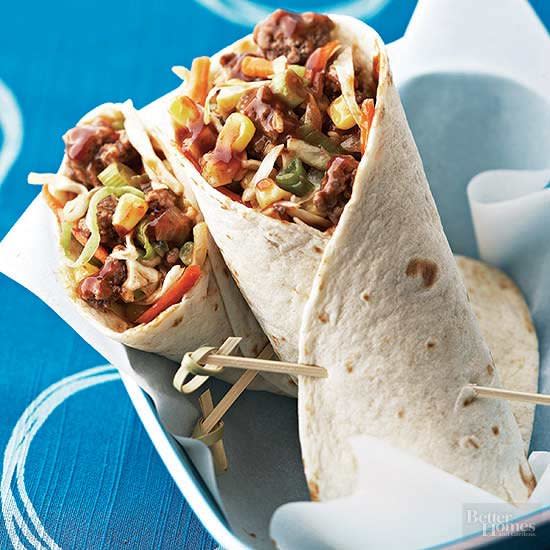 Bust loose from you turkey-sandwich rut right now with our creative wrap recipes! Here, you’ll find your next favorite beef, pork, or chicken wrap recipe, plus tuna and veggie wrap recipes, too. But before you unwrap your midday masterpiece, better copy this link: The colorful combo might create lunch envy among your coworkers, so be prepared to share these clever lunch wrap ideas with everyone.