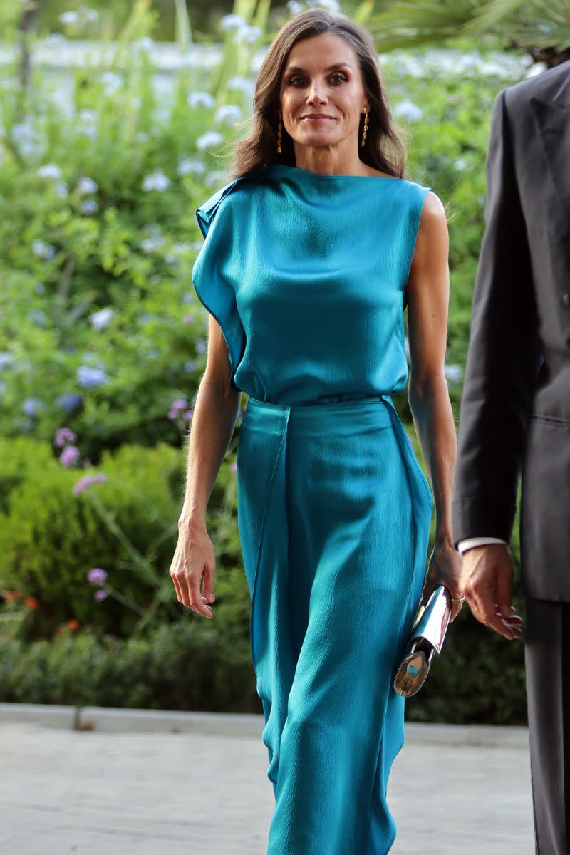 <p> Another example of a hue that looks gorgeous on Queen Letizia, this blue-green silky co-ord will always be one of our all-time favourite outfits of hers. The asymmetric neckline and flowy layered skirt are both timeless and modern, working in harmony with the unforgettable colour. </p>