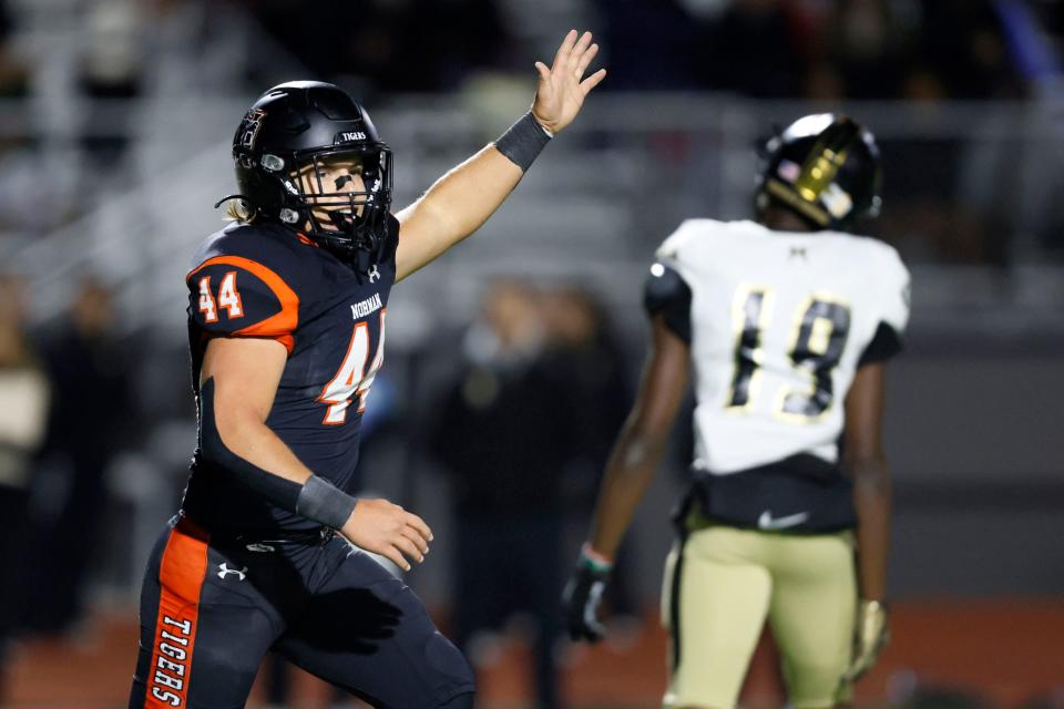 Norman's Behr Boyd celebrates after Norman stopped Broken Arrow on a fourth down during a Class 6A-I first round playoff game on Nov. 9 in Norman.