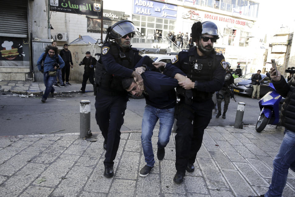 <p>Israel police arrest a Palestinian during a protest against President Donald Trump’s decision to recognize Jerusalem as the capital of Israel in Jerusalem, Saturday, Dec. 9, 2017.(Photo: Mahmoud Illean/AP) </p>