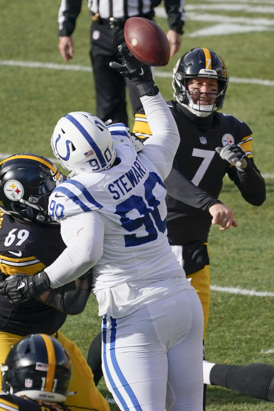 Indianapolis Colts defensive tackle Grover Stewart (90) tips a pass by Pittsburgh Steelers quarterback Ben Roethlisberger (7) during the first half of an NFL football game, Sunday, Dec. 27, 2020, in Pittsburgh. (AP Photo/Gene J. Puskar)