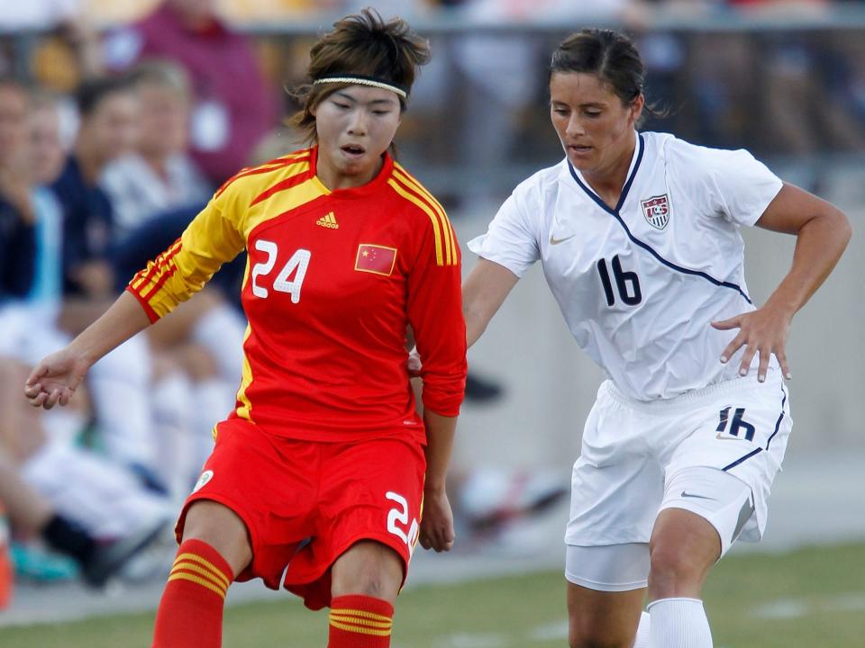 Ali Krieger defends against China's Yasha Gu.