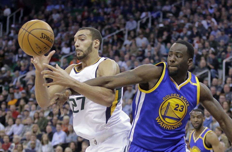 Rudy Gobert and Draymond Green have their teams near the top of the NBA in defensive efficiency. (AP)