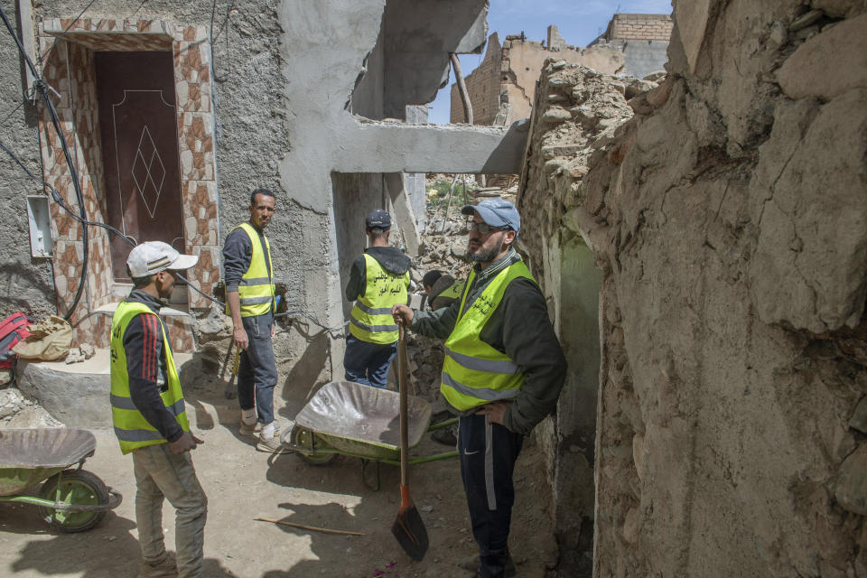 Workers clear the rubble left after the earthquake in Amizmiz, near Marrakech, Thursday, April 4, 2024. (AP Photo)