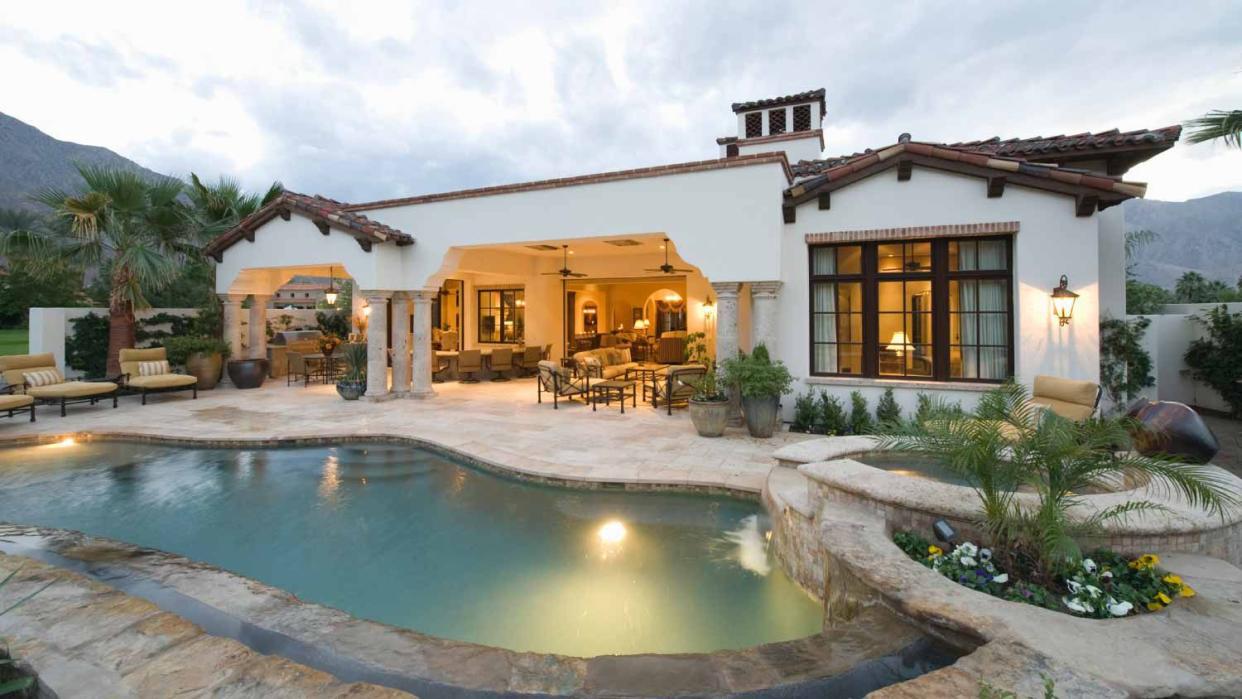 View of swimming pool and modern home exterior