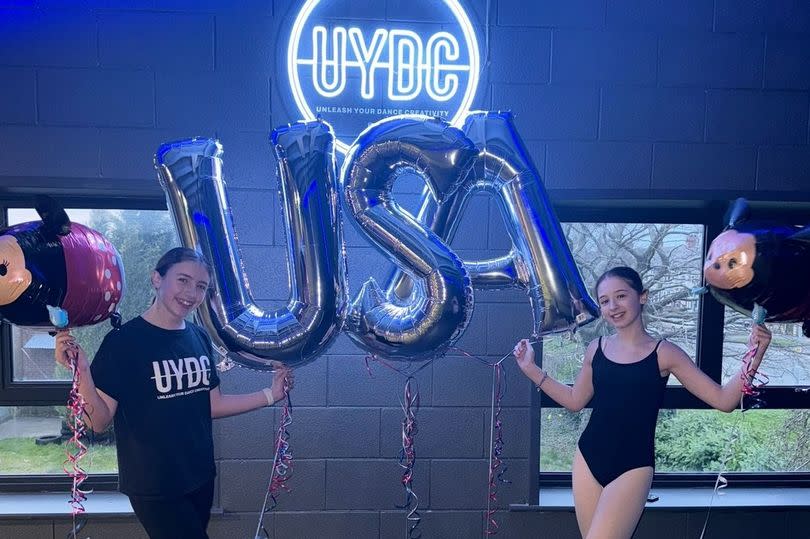 India Blount, left, and Amirah Storey celebrate the news of being chosen to go to the USA at UYDC Dance Studio in Hull