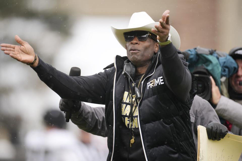 Colorado head coach Deion Sanders plays to the fans in the first half of the team’s spring game Saturday, April 22, 2023, in Boulder, Colo. | David Zalubowski, Associated Press