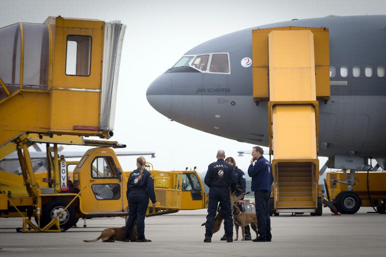 Some members of the Urban Search and Rescue team get ready to leave with their tracker dogs for Nepal to help search for victims after the earthquake at Eindhoven Airport, on April 26, 2015