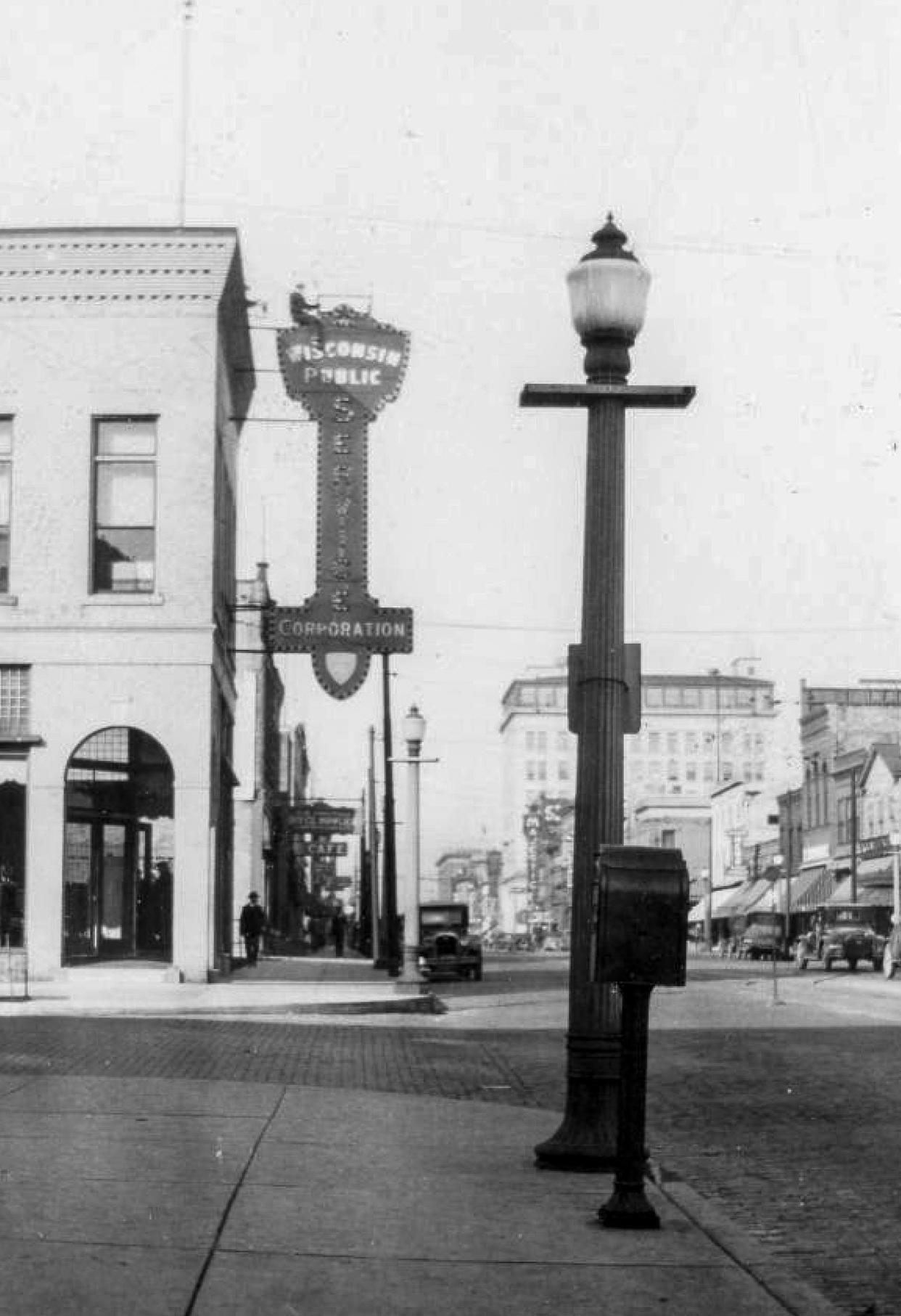 A street lamp at 8th and Pennsylvania sometime after 1924 in Sheboygan, Wis. The photo, which also shows the brick streets the city had, illustrates the home for Wisconsin Public Service at the time.