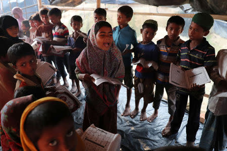 Young Rohingya refugees learn to recite the Koran in an Arabic school at Palongkhali makeshift refugee camp in Cox's Bazar, Bangladesh, November 7, 2017. REUTERS/Mohammad Ponir Hossain