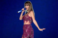 <p>Swift recreated one of her memorable <a href="https://people.com/celebrity/taylor-swift-1989-tour-guests-nick-jonas-serayah-serena-williams-uzo-aduba/" rel="nofollow noopener" target="_blank" data-ylk="slk:1989 World Tour outfits;elm:context_link;itc:0;sec:content-canvas" class="link "><em>1989</em> World Tour outfits</a> as she wore a matching Roberto Cavalli top and skirt. The pink set was perfectly paired with dazzling Christian Louboutin boots. </p>