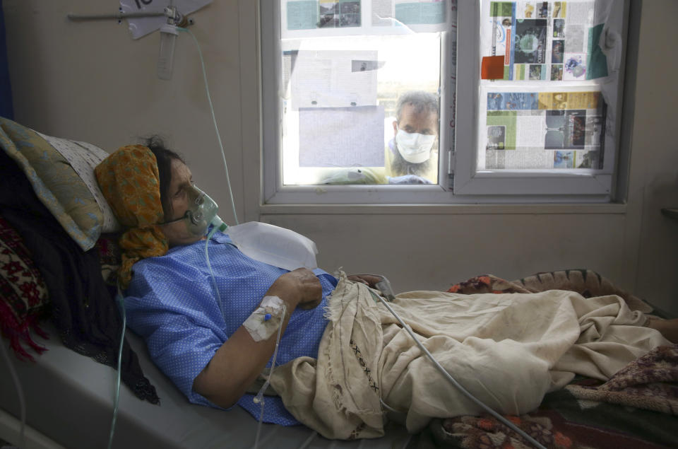 A patient is connected to oxygen tank in the Intensive Care Unit ward for COVID-19 patients at the Afghan-Japan Communicable Disease Hospital in Kabul, Afghanistan, Tuesday June 30, 2020. (AP Photo/Rahmat Gul)