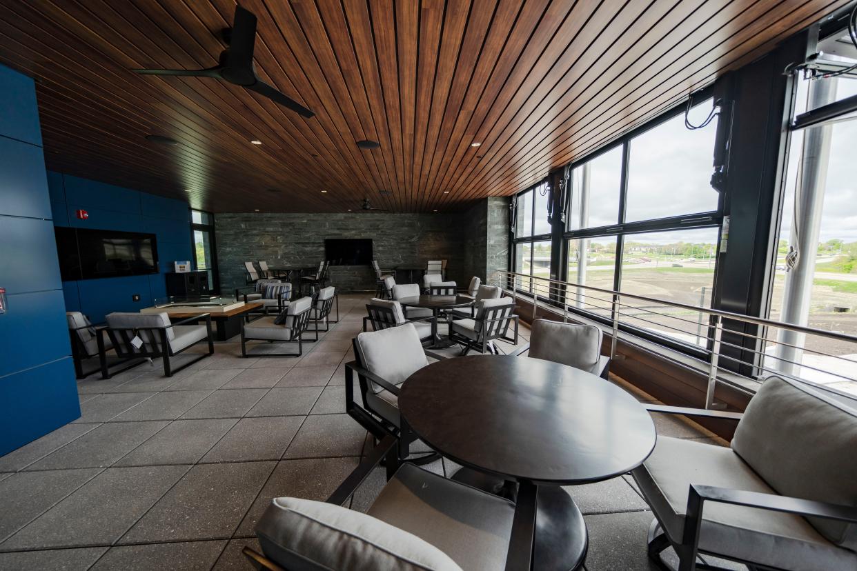 An entertainment area on the top floor of the new West Bank building that features retractable windows a fireplace and wall-mounted TVs, Monday, April 29, 2024.