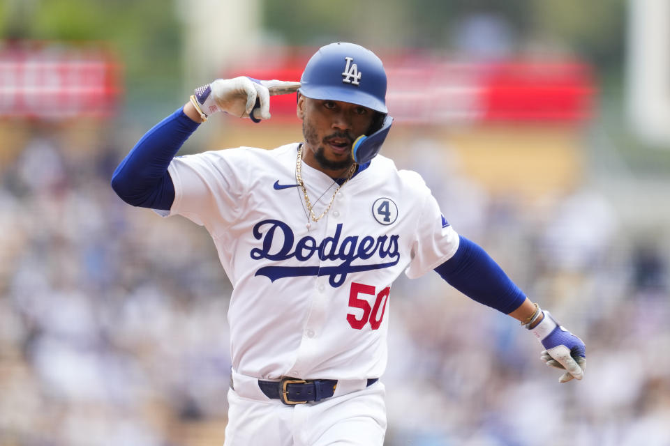 Los Angeles Dodgers' Mookie Betts runs the bases after hitting a home run during the first inning of a baseball game against the Colorado Rockies in Los Angeles, Sunday, June 2, 2024. (AP Photo/Ashley Landis)