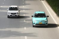 This photo shows Vinfast electric cars in traffic in Hanoi, Vietnam on June 10, 2024. Vietnamese automaker VinFast just can’t sell enough cars, so it's hoping its tiniest and cheapest car yet — a roughly 10-foot-long mini-SUV priced at $9,200 and called the VF3 — will become Vietnam's “national car" and win over consumers in Asian markets. (AP Photo/Hau Dinh)