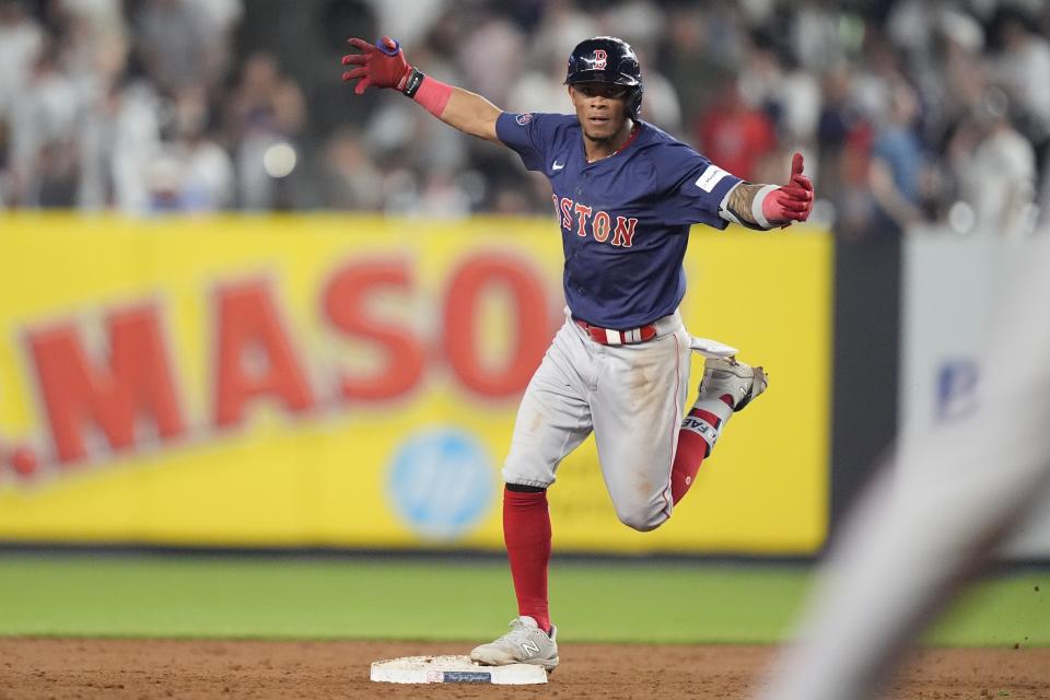 Boston Red Sox's Ceddanne Rafaela gestures toward teammates as he runs the bases after hitting a two-run home run during the 10th inning of a baseball game against the New York Yankees, Friday, July 5, 2024, in New York. (AP Photo/Frank Franklin II)