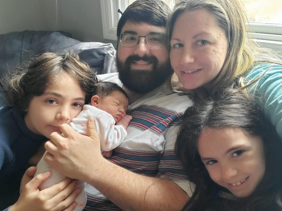 Jennifer Skolsky went into quick labor on New Year's Day morning and delivered her baby, Galaxy Veronica Mave, at home in the bathroom. She is seen here later in the day at their Rockaway Township home with her husband, Kyle, son, Anikan, and daughter, Journie.