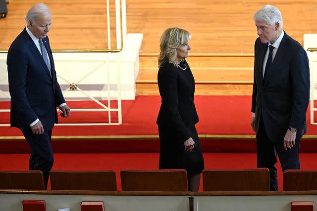 <p>ANDREW CABALLERO-REYNOLDS/AFP via Getty Images</p> The Bidens and Bill Clinton at Rosalynn Carter's Nov. 28 tribute service