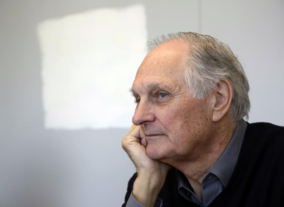 In this Friday, April 26, 2013 photo, actor Alan Alda listens during an interview at Stony Brook University, on New York's Long Island. The film and television star is trying to encourage scientists of all disciplines to ditch the jargon and speak in plain English. (AP Photo/Richard Drew)