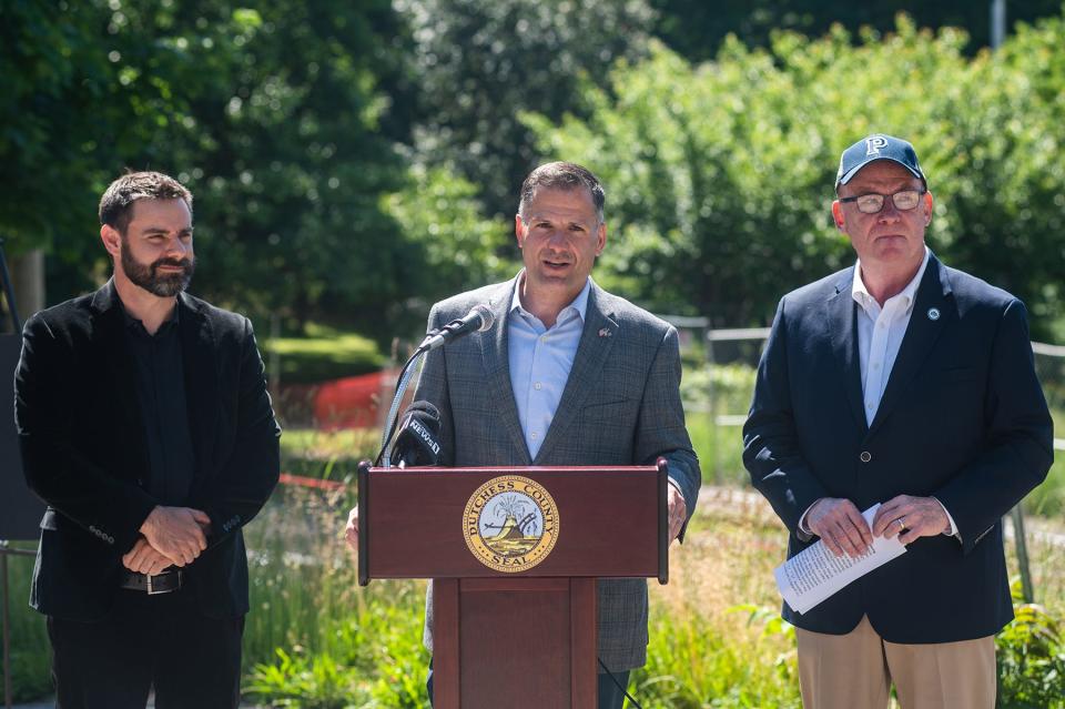 Marc Molinaro, Dutchess County Executive, center, talks during a press conference for the start of demolition of the YMCA building in the city of Poughkeepsie, NY on Monday, June 6, 2022.