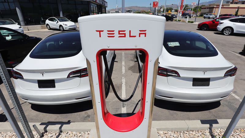 Electric cars charge at the Tesla dealership in Salt Lake City on Friday, June 4, 2021. Driving an electric car is easy, writes Lee Benson, but charging one can be more difficult.