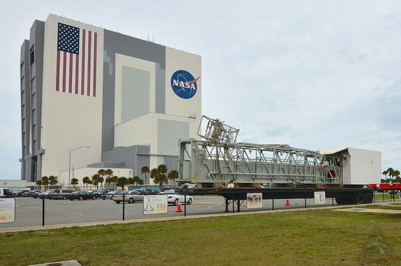 The orbiter access arm and white room from NASA's Launch Pad 39A have been temporarily moved outside the Vehicle Assembly Building at the Kennedy Space Center in Florida.