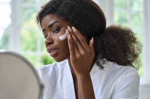 <span class="caption">Sunscreens can help reduce the amount of damaging radiation our skin gets.</span> <span class="attribution"><a class="link " href="https://www.shutterstock.com/image-photo/attractive-young-black-african-woman-model-2052802880" rel="nofollow noopener" target="_blank" data-ylk="slk:Ground Picture/ Shutterstock;elm:context_link;itc:0;sec:content-canvas">Ground Picture/ Shutterstock</a></span>