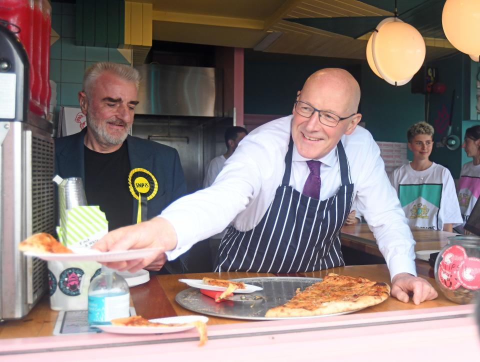 SNP Leader John Swinney (right) joins the SNP candidate for Edinburgh East and Musselburgh, Tommy Sheppard, serving pizza at Portobello Beach and Promenade, (Michael Boyd/PA Wire)