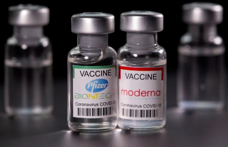 FILE PHOTO: Picture illustration of vials with Pfizer-BioNTech and Moderna coronavirus disease (COVID-19) vaccine labels