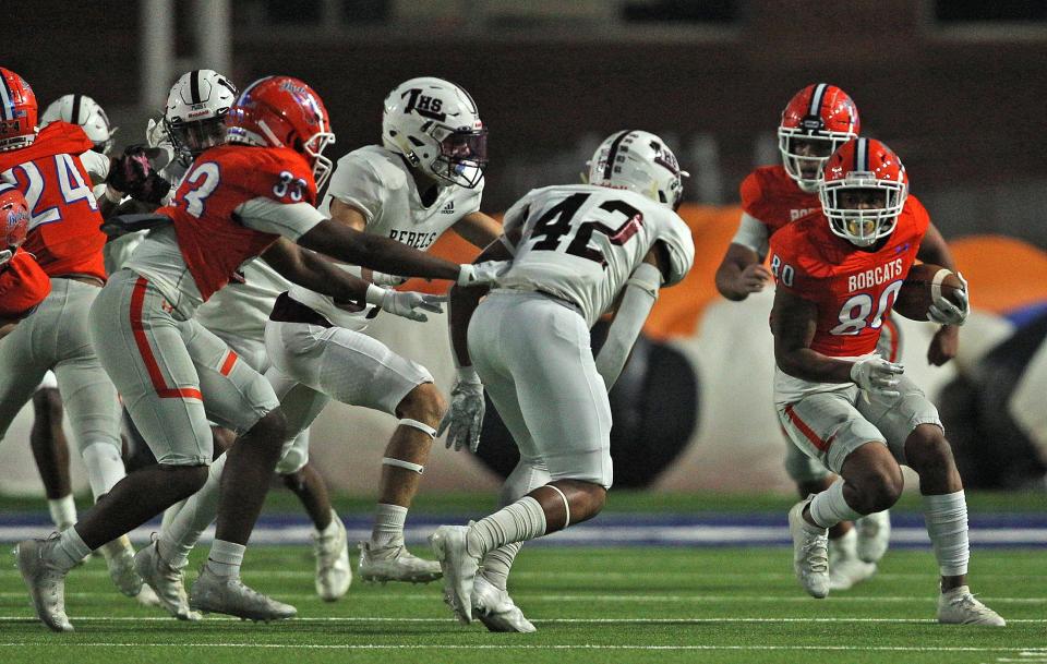 Keevon Rice (80) rushes the ball for Central during a game against Legacy on Friday, Oct. 29, 2021.