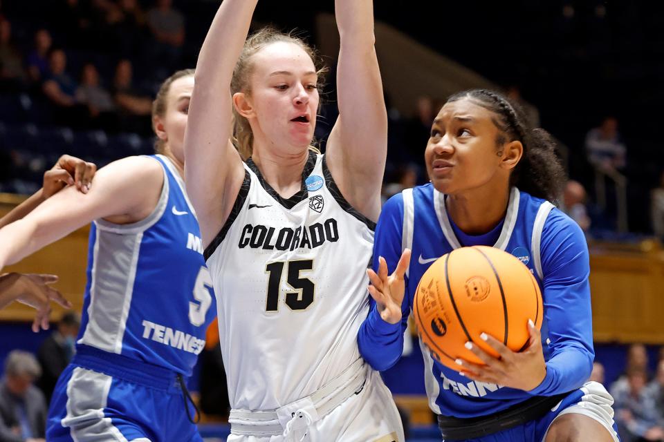 Middle Tennessee State's Courtney Blakely, left, drives the ball around Colorado's Kindyll Wetta (15) during the first half of a first-round college basketball game in the NCAA Tournament, Saturday, March 18, 2023, in Durham, N.C. (AP Photo/Karl B. DeBlaker)