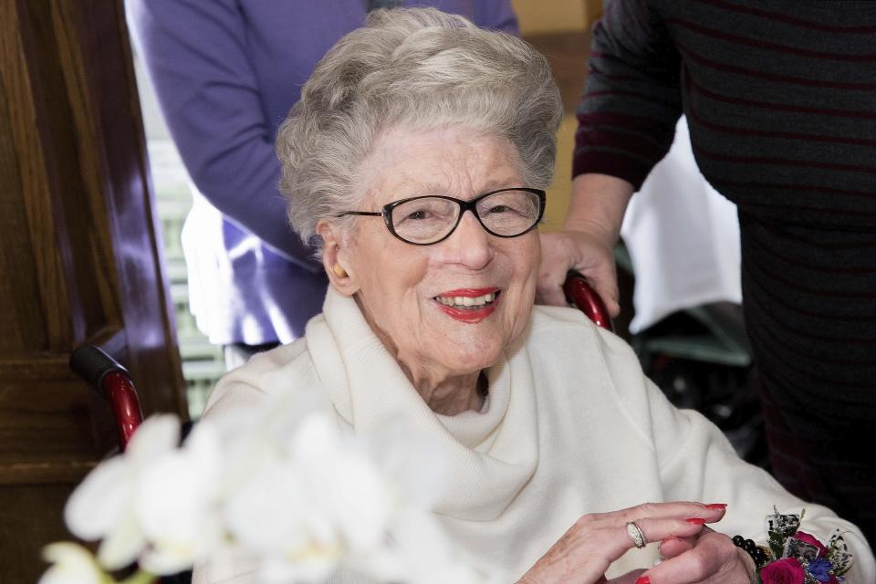 In this Feb. 17, 2018, photo provided by Nicholas Gerber, centenarian Norma Bratschi Hoza celebrates a birthday in Glenview, Ill. Bratschi Hoza died of COVID-19 at the age of 101 on April 2, 2020. Centenarians are among the most vulnerable of those succumbing to the coronavirus pandemic. (Nicholas Gerber via AP)