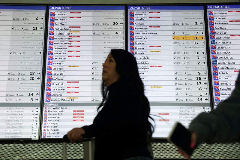 FILE PHOTO: Travellers deal with weather cancellations in Dallas in December 2022