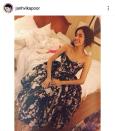 The starlet has been on Instagram since April 2014. Her first upload was quite a simple, homely click. We guess it is her bedroom where she sits, beaming in a black floral strapless dress.