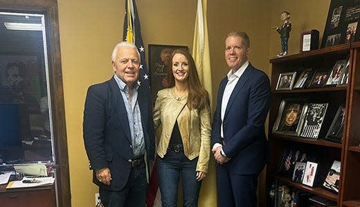 District 26 state Sen. Joe Pennacchio, left, stands with Roxbury resident Kristen Cobo and Shawn Hyland of the New Jersey Family Policy Center. Cobo is one of four named defendants in a lawsuit from the Roxbury High School librarian, who claims they are defaming her in public as a "pornographer."