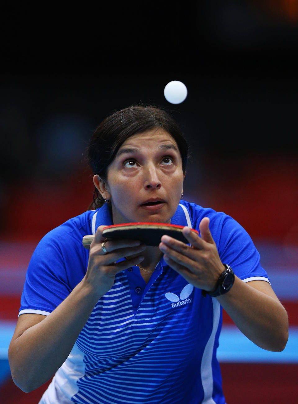 "I should have drank some coffee this morning." <br> LONDON, ENGLAND - JULY 28: Berta Rodriguez of Chile serves against Yuan Tian of Croatia during their Women's Singles Table Tennis match on Day 1 of the London 2012 Olympic Games at ExCeL on July 28, 2012 in London, England. (Photo by Feng Li/Getty Images)